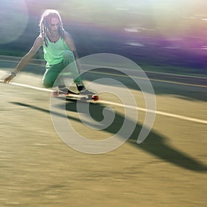 Action image of teenager doing a trick by skateboard