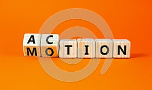 Action or motion symbol. Concept word Motion and Action on wooden cubes. Beautiful orange table orange background. Business and