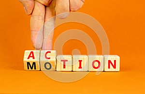 Action or motion symbol. Concept word Motion and Action on wooden cubes. Businessman hand. Beautiful orange table orange