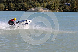 Action Photo Man on jet ski.