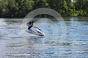 Action Photo Man on jet ski. Jump.