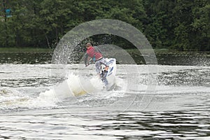 Action Photo Man on seadoo. A view from the back.