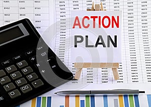 Action Plan - business concept. text at canvas with wood stand and pen on chart