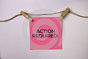 Action Required! on sticky notes isolated on white background