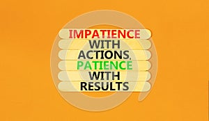 Action and result symbol. Concept words Impatience with actions patience with results on wooden sticks. Beautiful orange table