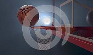 An action shot of a regular basketball teetering on the rim of a red basketball