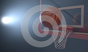 An action shot of a regular basketball teetering on the rim of a red basketball hoop photo