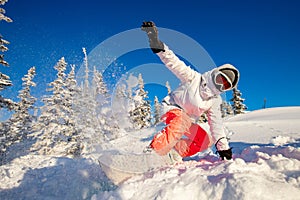 Action snowboarder on snowboard rides on fresh snow in forest, dust explosion. Freeride in Alps Ski Resort