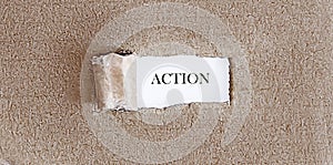 ACTION text on appearing behind torn brown paper