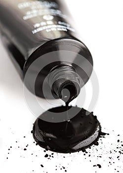 Activated carbon face mask flows from cosmetic tube