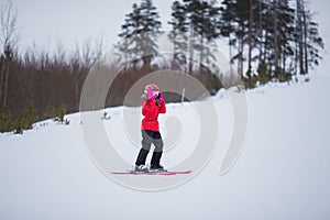 Active adorable preschooler caucasian girl portrait with ski in helmet  goggles and bright suit enjoy winter extreme sport