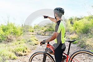 Active athlete talking with a cyclist outdoors