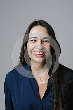 Active beautiful middle-aged woman smiling friendly and looking in camera.