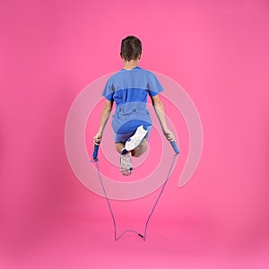 Active boy jumping rope