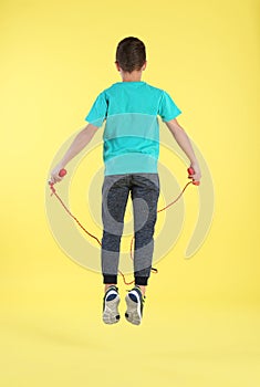 Active boy jumping rope