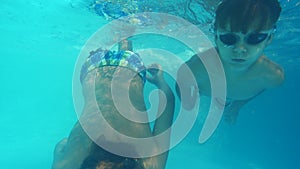 Active boys swimming in the pool