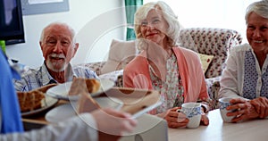 Active Caucasian senior people smiling on dining table at nursing home 4k