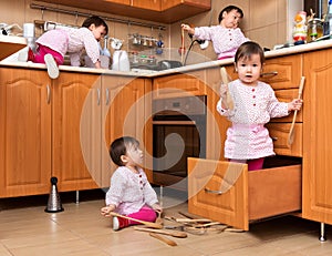 Active child playing in the kitchen