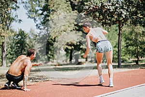 Active Duo Showcasing Fit Bodies and Motivation with Cartwheel in Sunny Park