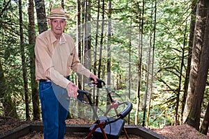 Active Elderly Man with Walker in Forest