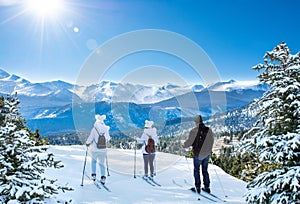 Active family skiing on winter vacation.