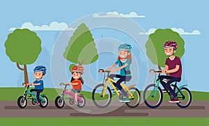 Active family vacation. Father mother, son and daughter are riding on bicycles in the park