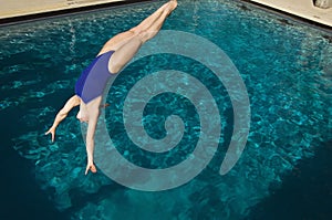 Active Female Swimmer Diving