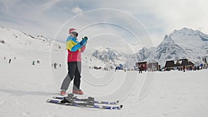 Active girl skiing in mountains. Ski race for young children. Little skier racing in snow