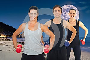 Active Group of Smiling Friends Enjoying Beach Exercise