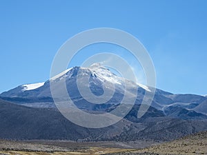 The active Guallatiri Volcano in Chile photo