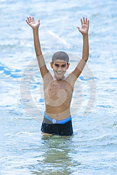 Active Happy Boy Playing in Water