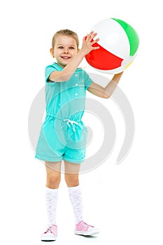 Active happy little girl playing with air ball