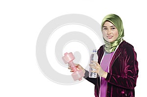 Active healthy hijab woman and dumbells for promoting a healthy fitness and lifestyle concept