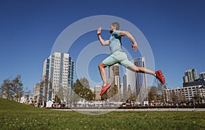 Active healthy runner jogging outdoor. Healthy lifestyle middle aged man runner running on urban citi San Diego.