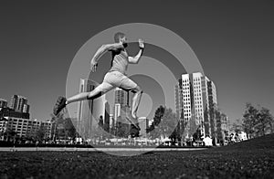 Active healthy runner jogging outdoor. Healthy lifestyle middle aged man runner running on urban citi San Diego. photo