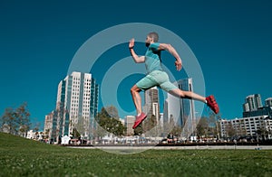 Active healthy runner jogging outdoor. Healthy lifestyle middle aged man runner running on urban citi San Diego. photo