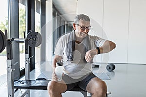 Active senior exercising in a gym