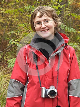 Active hiking girl with digital camera