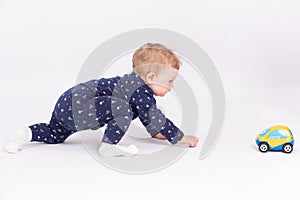 Active infant plays with a toy car