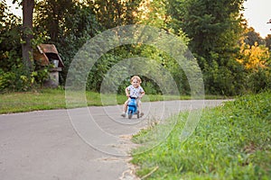 Active kid playing and cycling outdoors