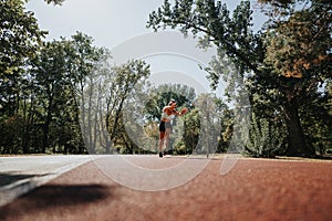 Active Lifestyle. Attractive Athletes Enjoying a Sunny Day in the Park While Training and Doing Cartwheels on a Race