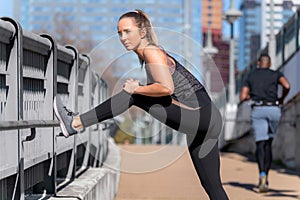 Active lifestyle candid portrait of a toned, muscular jogger with muscular shape, butt, legs, and body, motivational serious expre