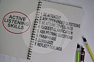 Active Listening Skills write on a book with keyword isolated on Wooden Table