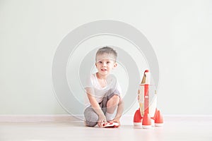 Active little boy playing the rocket toys, Child showing rocket toy with happy face, Children or Toddler learning and