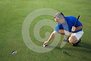 Active Male Golfer Putting