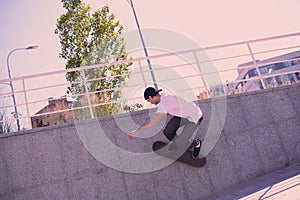 Active male person doing extreme tricks on skateboard