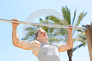 Active man pull up exercise workout