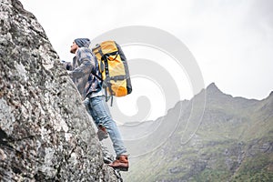 Brave alone lifestyle tourist conquers the mountain photo