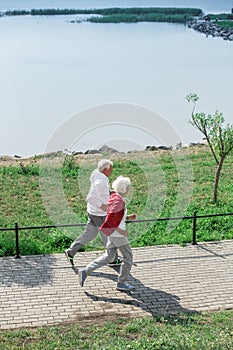 Active Mature Couple Running Outdoors