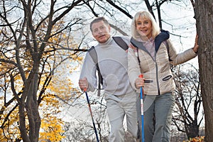 Active middle aged couple hiking outdoors